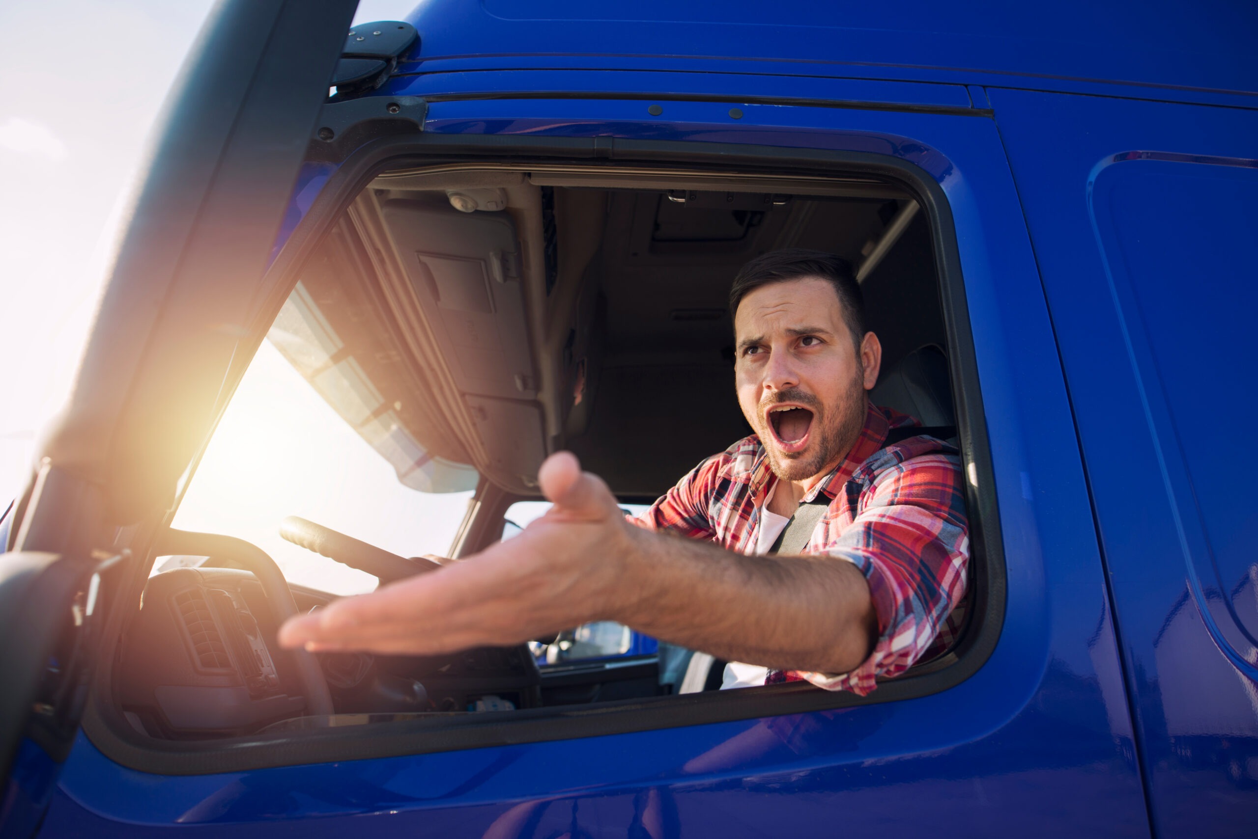 Angry-truck-driver-yells-at-other-drivers-from-behind-the-wheel