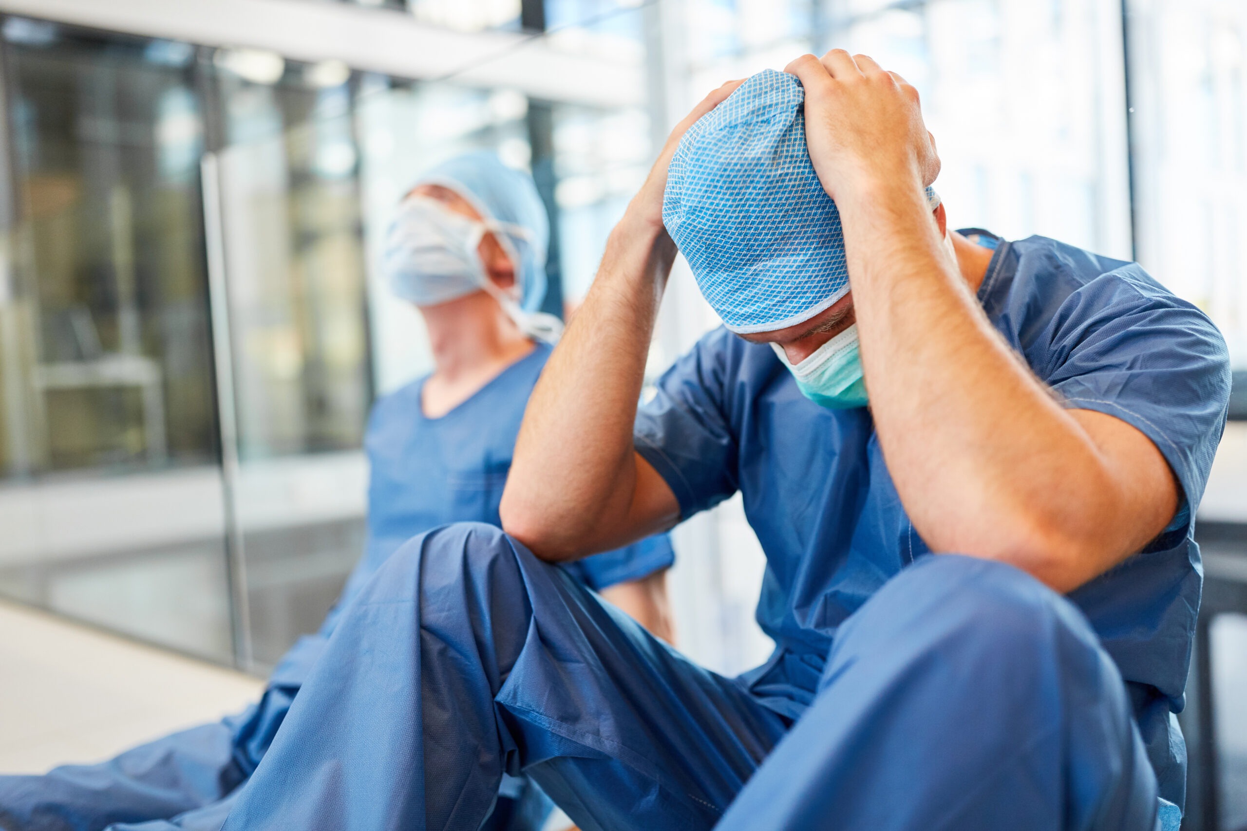 Stressed-doctors-sit-on-the-floor-in-the-hospital